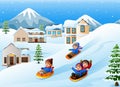 Children playing sledding in the snow