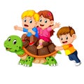 Children`s riding giant turtle Royalty Free Stock Photo