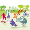 Children with skateboards and bicycles