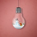 Christmas card with a snowman in the hanging light bulbs Royalty Free Stock Photo