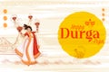 couple performing Dhunchi dance in Happy Durga Puja Subh Navratri Indian religious header banner background Royalty Free Stock Photo