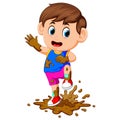 Cute boy playing in the mud