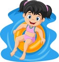 Cute little girl with swimsuit floating on inflatable ring Royalty Free Stock Photo