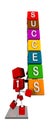 Illustration of 3d red cube character carrying colourful cubes with success word