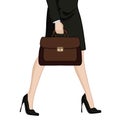 Businesswoman in high heels with briefcase