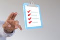 Illustration of a digital checklist or todo-list and a touching hand