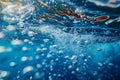 Digital image of photo of deep blue ocean water, light bubbles at the surface, underwater view, low angle shot, wideangle len Royalty Free Stock Photo