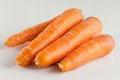 Digital image of three orange carrots on a white background, high quality, high resolution Royalty Free Stock Photo