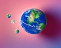 Earth green globe with pastel background. Artistic drops of water in the shape of mini globes. AI Generated