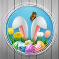 Easter round frame with colorful eggs, bunny ears, flowers, grass, and insects on wood wall background