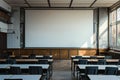 Elegant  a large, blank white projector screen was set up in an empty university classroom with desks and chairs arranged nea Royalty Free Stock Photo