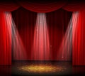 Empty stage with red curtain and spotlight on wooden floor Royalty Free Stock Photo