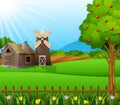 Farm landscape with shed and brown windmill on daylight Royalty Free Stock Photo