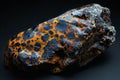 Featuring a  piece of meteorite with leopard print patterns, featuring dark brown and orange colors against a black backgroun Royalty Free Stock Photo