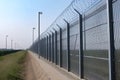 Illustration of a fence between two countries, 3 metres high, barbed wire, Border fence, militarily.