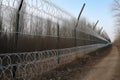 Illustration of a fence between two countries, 3 metres high, barbed wire, Border fence, militarily.