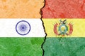 Illustration of the flags of India and Bolivia separated by a crack - conflict or comparison