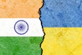 Illustration of the flags of India and Ukraine separated by a crack - conflict or comparison