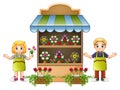 Florist girl and boy in the flower shop