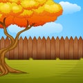 Garden background with autumn tree and wooden fence Royalty Free Stock Photo