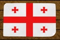 Illustration of a Georgian flag painted on the papier pasted on