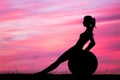 Girl doing pilates at sunset