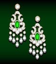 gold jewelry earrings with emerald and precious stones Royalty Free Stock Photo