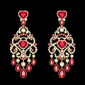 gold jewelry earrings with ruby and precious stones Royalty Free Stock Photo