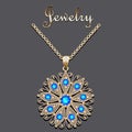 gold pendant with filigree and precious stone