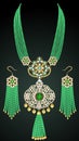 golden necklace and earrings with beads, emeralds and precious stones Royalty Free Stock Photo