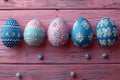 Graphic a row of easter eggs with blue and white patterns on the side, pink background, minimalist style, flat lay compositio Royalty Free Stock Photo