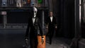 Illustration of a gray alien wearing a tuxedo walking a dark street