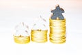 Illustration of growth with piles of ten cent coins and wooden meeples on white background Royalty Free Stock Photo