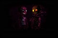 Halloween background with a pair of zombie kids on the dark wall