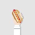 Illustration of hand holding hotdog