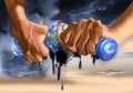 Hands wringing oil from globe