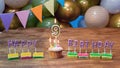 Illustration Happy birthday greeting card to 9 year old child, festive cupcake with burning candles and birthday decorations Royalty Free Stock Photo