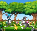 Happy bunnies playing with baby chick in the park Royalty Free Stock Photo