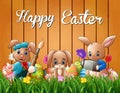 Happy easter bunnies on a background fence Royalty Free Stock Photo