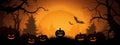 Illustration of Happy Halloween background, silhouettes of trees and pumpkins on orange background, minimal concept Royalty Free Stock Photo