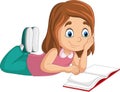 Happy little girl laying and reading a book Royalty Free Stock Photo