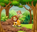 Happy zookeeper boy and lion in a forest Royalty Free Stock Photo
