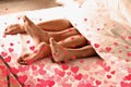 Illustration of hearts and passionate young couple having sex on bed at home, closeup of legs Royalty Free Stock Photo