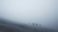 Hikers at distance during a strong blizzard