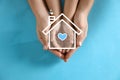 Illustration of house and happy family holding hands on blue background Royalty Free Stock Photo