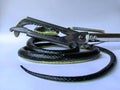 Illustration of how to clamp the snake& x27;s head in the snake rescue process with a rubber snake. Royalty Free Stock Photo