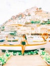 Illustration image of blurry painting of Positano on Summer with brunette bikini girl standing near white boat on beach Royalty Free Stock Photo