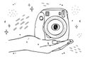 Illustration instant camera lies on the palm of your hand