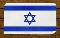 Illustration of an Israeli flag on the papier pasted on the woody wall