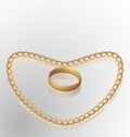 Jewelry ring on golden chain of heart shape Royalty Free Stock Photo